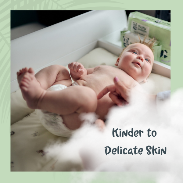 Baby lying on a changing table with text 'Kinder to Delicate Skin' on a green border